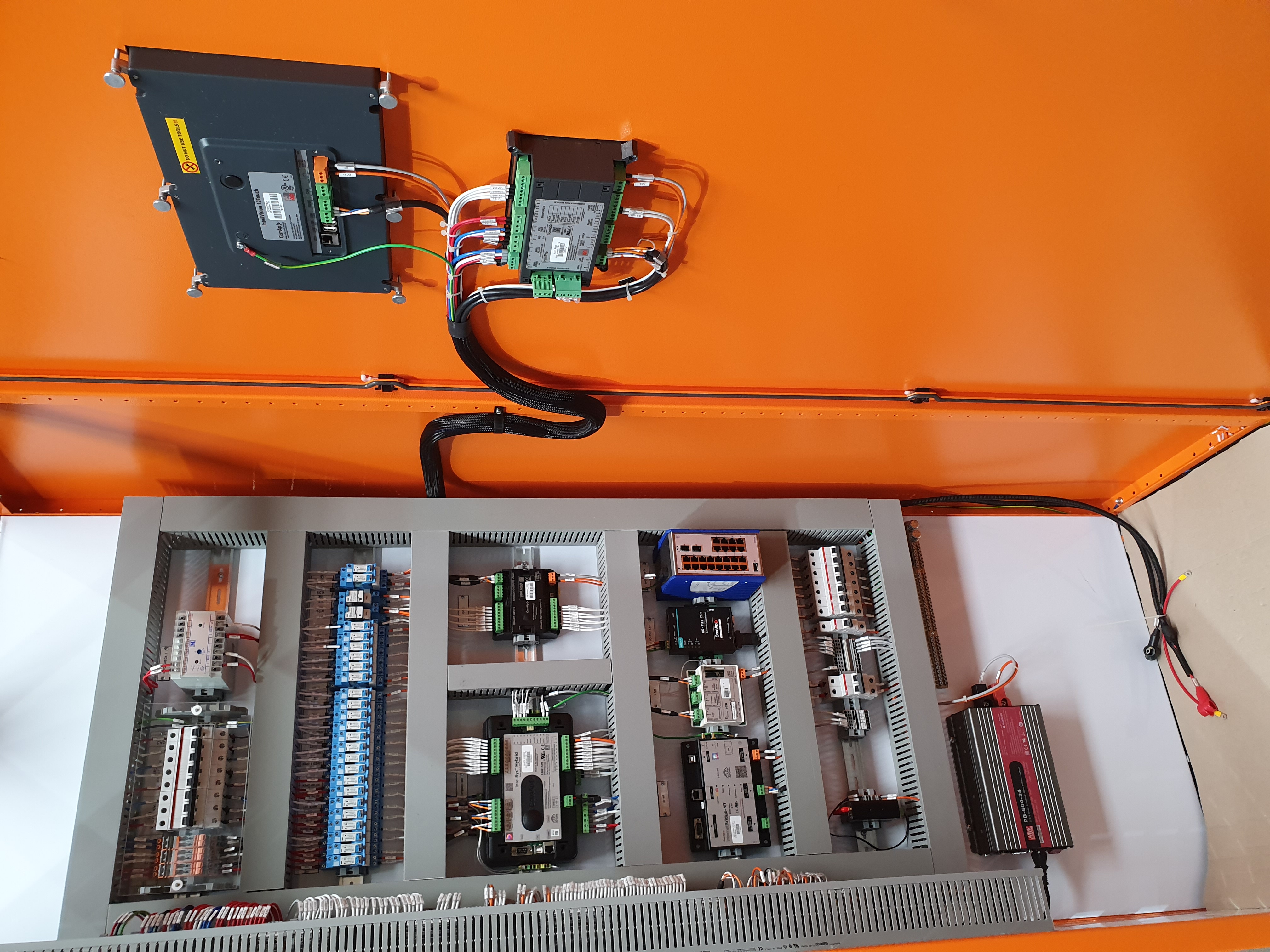 PLC control panel interior showing precision wiring and components